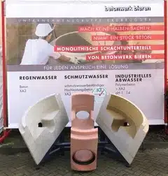 Betonfertigteil vor Banner der Firma BIEREN